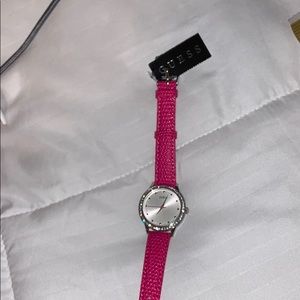 Pink snakeskin silver watch.